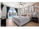 Bright bedroom with poolside view, cactus decor, and sliding glass doors to the outdoor area at 8213 E Whitton Ave, Scottsdale, AZ 85251