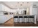Bright and modern kitchen with white cabinetry, stainless steel appliances, and a spacious center island at 8213 E Whitton Ave, Scottsdale, AZ 85251
