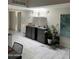 An entertaining area features a built-in bar and unique lighting under a skylight at 8302 N 21St Dr # L204, Phoenix, AZ 85021