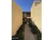 Exterior view of a pathway between buildings, with stairs leading to second-floor apartments at 8302 N 21St Dr # L204, Phoenix, AZ 85021