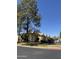 Exterior view of complex with mature landscaping and stairwell access at 8302 N 21St Dr # L204, Phoenix, AZ 85021