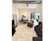 Bright living area features tile floors, high ceilings, stylish furniture, and a modern ceiling fan at 8302 N 21St Dr # L204, Phoenix, AZ 85021