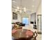 Open floor plan with tile floors, a modern fireplace, and stylish lighting fixtures at 8302 N 21St Dr # L204, Phoenix, AZ 85021