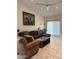 Inviting living room featuring a comfortable sectional sofa, stylish decor, and ample natural light at 8302 N 21St Dr # L204, Phoenix, AZ 85021