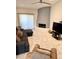 A bright living room features a unique fireplace and plush seating at 8302 N 21St Dr # L204, Phoenix, AZ 85021