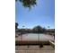 Exterior full tennis court surrounded by a fence with green and red surfaces at 8302 N 21St Dr # L204, Phoenix, AZ 85021