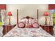 Cozy bedroom with a decorative four-poster bed and charming bedside lamps at 8712 N 64Th Pl, Paradise Valley, AZ 85253