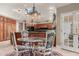 Elegant eat-in kitchen featuring a skylight, dark countertops, and a stylish chandelier at 8712 N 64Th Pl, Paradise Valley, AZ 85253