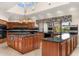 Modern kitchen features a large island, black granite counters, custom cabinets and natural light at 8712 N 64Th Pl, Paradise Valley, AZ 85253