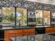 Kitchen sink with granite counters, custom cabinets and a large window offering natural light at 8712 N 64Th Pl, Paradise Valley, AZ 85253