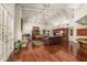 Spacious living room featuring hardwood floors, exposed beam ceilings, and ample natural light at 8712 N 64Th Pl, Paradise Valley, AZ 85253