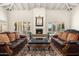 Cozy living room featuring a fireplace, hardwood floors, and access to the backyard at 8712 N 64Th Pl, Paradise Valley, AZ 85253