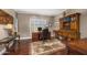 Office boasts hardwood floors, built-in shelving, a shuttered window, and traditional furnishings at 8712 N 64Th Pl, Paradise Valley, AZ 85253