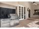 Built-in outdoor kitchen with a stainless steel grill and convenient access to the house at 8712 N 64Th Pl, Paradise Valley, AZ 85253