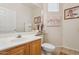 Well-lit half bathroom featuring a neutral color scheme and stylish decor at 1024 E Frye Rd # 1063, Phoenix, AZ 85048