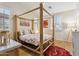 Cozy bedroom with unique wooden four-poster bed and light-filled windows at 1024 E Frye Rd # 1063, Phoenix, AZ 85048