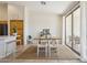 Dining area with hardwood floors, neutral walls, sliding glass doors, and a modern table set at 1024 E Frye Rd # 1063, Phoenix, AZ 85048