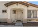 Charming front entryway with a beige door, desert landscaping, and stucco walls at 1024 E Frye Rd # 1063, Phoenix, AZ 85048