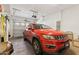 Spacious garage with parking for a red SUV, and ample storage at 1024 E Frye Rd # 1063, Phoenix, AZ 85048