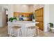 Bright kitchen with modern appliances, tile floors, neutral walls, and a large countertop island at 1024 E Frye Rd # 1063, Phoenix, AZ 85048