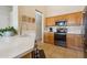 Bright kitchen with modern appliances, tile floors, neutral walls, and a large countertop island at 1024 E Frye Rd # 1063, Phoenix, AZ 85048