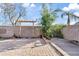 This backyard features brick pavers, a wooden pergola, and landscaping, creating a great outdoor space at 1051 W Inca St, Mesa, AZ 85201