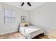 Cozy bedroom featuring a comfortable bed, minimalist decor, and a well-lit atmosphere at 1051 W Inca St, Mesa, AZ 85201