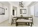 Cozy dining area with modern light fixture, neutral decor, table and seating for six at 1051 W Inca St, Mesa, AZ 85201