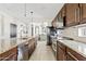Kitchen featuring granite countertops, stainless steel appliances, dark wood cabinets at 1051 W Inca St, Mesa, AZ 85201