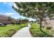 A landscaped walking path meanders through the community on a beautiful, sunny day at 1051 W Inca St, Mesa, AZ 85201