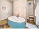 Luxurious bathroom features a freestanding tub with tiled surround and a separate glass-enclosed shower at 10801 E Happy Valley Rd # 4, Scottsdale, AZ 85255