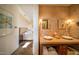 Stylish bathroom with dual vessel sinks, stone countertops, and elegant sconce lighting at 10801 E Happy Valley Rd # 4, Scottsdale, AZ 85255