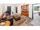 Inviting living room with hardwood built-ins, leather seating, and desert-inspired decor at 10801 E Happy Valley Rd # 4, Scottsdale, AZ 85255