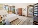 Bright main bedroom featuring floor-to-ceiling windows with desert views and stylish Southwestern decor at 10801 E Happy Valley Rd # 4, Scottsdale, AZ 85255
