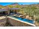 Stunning backyard with a sleek, modern pool, stone accents, and mountain views for upscale outdoor living at 10801 E Happy Valley Rd # 4, Scottsdale, AZ 85255