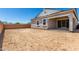 Home exterior featuring a covered patio and an expansive backyard ready for landscaping at 12029 W Marguerite Ave, Avondale, AZ 85323