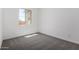 Bedroom with plush carpet and a view at 12029 W Marguerite Ave, Avondale, AZ 85323