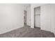 Bedroom with carpet and access to a walk-in closet and bathroom at 12029 W Marguerite Ave, Avondale, AZ 85323
