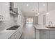 Open concept kitchen with quartz countertops, subway tile backsplash and stainless steel appliances at 12029 W Marguerite Ave, Avondale, AZ 85323