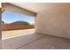 Covered patio and view of backyard area with block wall in the distance at 12029 W Marguerite Ave, Avondale, AZ 85323