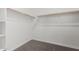 A walk-in closet featuring white walls and carpet at 12029 W Marguerite Ave, Avondale, AZ 85323