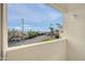 A charming balcony showcasing a view of palm trees, street access and common parking at 12123 W Bell Rd # 241, Surprise, AZ 85378