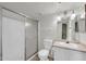 Clean, updated bathroom featuring a glass shower, modern toilet, and vanity sink at 12123 W Bell Rd # 241, Surprise, AZ 85378