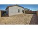 The backyard features a blank canvas, ready to be designed into your dream outdoor space at 15065 W Hackamore Dr, Surprise, AZ 85387