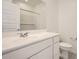 Close up of the bathroom vanity featuring a modern single sink and open door to shower at 15065 W Hackamore Dr, Surprise, AZ 85387