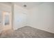 This bedroom offers neutral carpet, a closet with sliding doors, and ample natural light at 15065 W Hackamore Dr, Surprise, AZ 85387