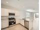 Modern kitchen featuring stainless steel appliances, white cabinets, and quartz countertops at 15065 W Hackamore Dr, Surprise, AZ 85387