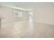 Open-concept space featuring tile floors, bright lighting, and a patio view at 15065 W Hackamore Dr, Surprise, AZ 85387