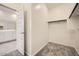 Walk-in closet with carpet and a rod for hanging garments at 15065 W Hackamore Dr, Surprise, AZ 85387