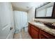 Bathroom featuring a vanity with granite countertop, cabinets, mirror and toilet at 1645 W Baseline Rd # 2026, Mesa, AZ 85202